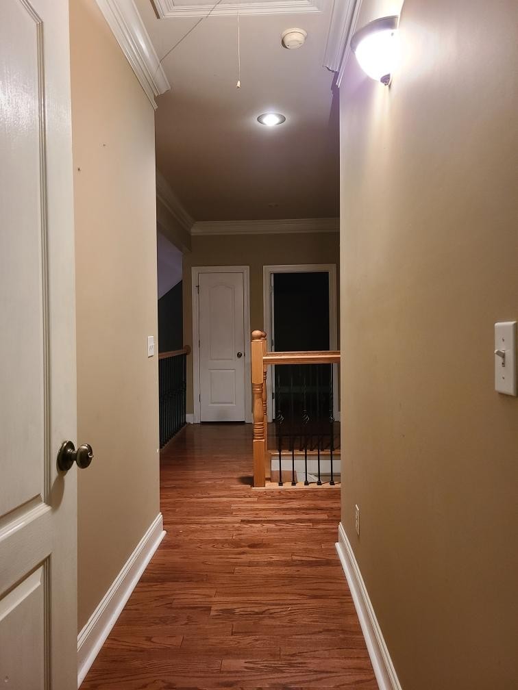 14 North George Road Flintville, TN 37335 - Photo 25 of 48 a view of a hallway with wooden floor and a bathroom