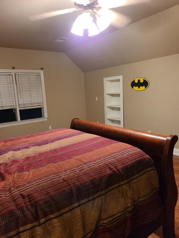 14 North George Road Flintville, TN 37335 - Photo 28 of 48 a bedroom with a bed and a chandelier