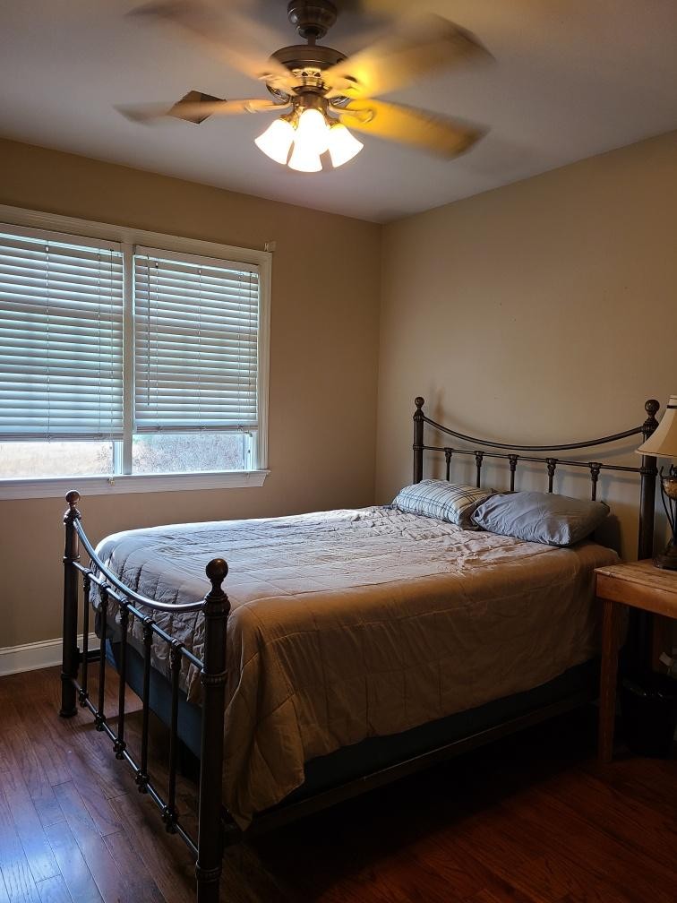 14 North George Road Flintville, TN 37335 - Photo 33 of 48 a bedroom with a bed and a chandelier