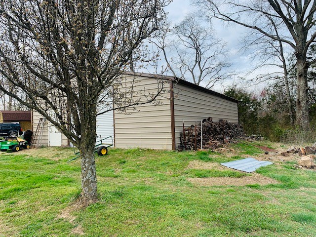 14 North George Road Flintville, TN 37335 - Photo 43 of 48 a backyard of a house with table and chairs