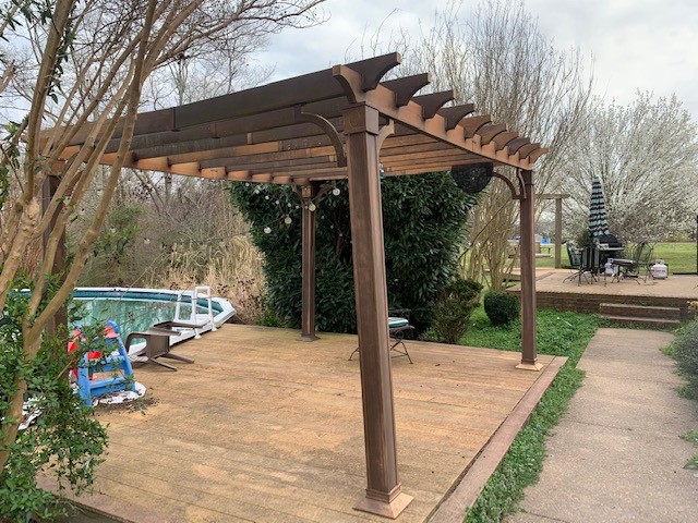 14 North George Road Flintville, TN 37335 - Photo 8 of 48 a view of a patio with a table and chairs under an umbrella