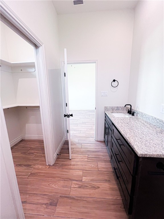 6918 Pacific Way Corpus Christi, TX 78414 - Photo 12 of 34 a spacious bathroom with a granite countertop sink