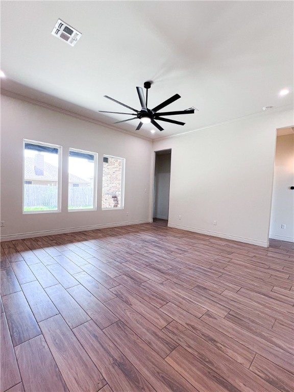 6918 Pacific Way Corpus Christi, TX 78414 - Photo 13 of 34 a view of an empty room with wooden floor and a window