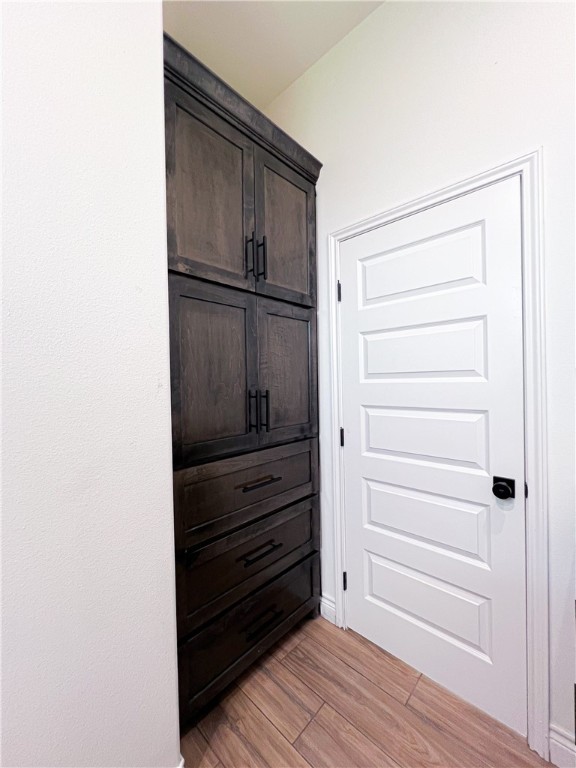 6918 Pacific Way Corpus Christi, TX 78414 - Photo 15 of 34 a view of walk in closet with empty racks