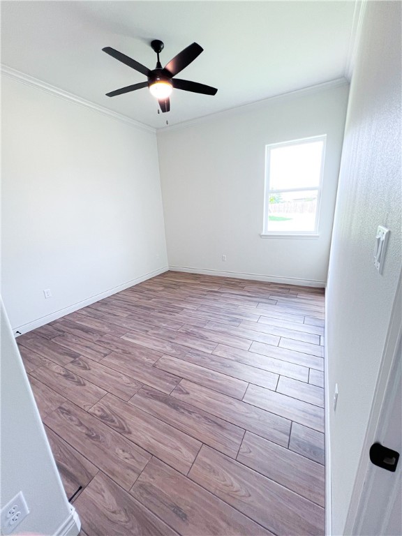 6918 Pacific Way Corpus Christi, TX 78414 - Photo 16 of 34 wooden floor in an empty room with a window