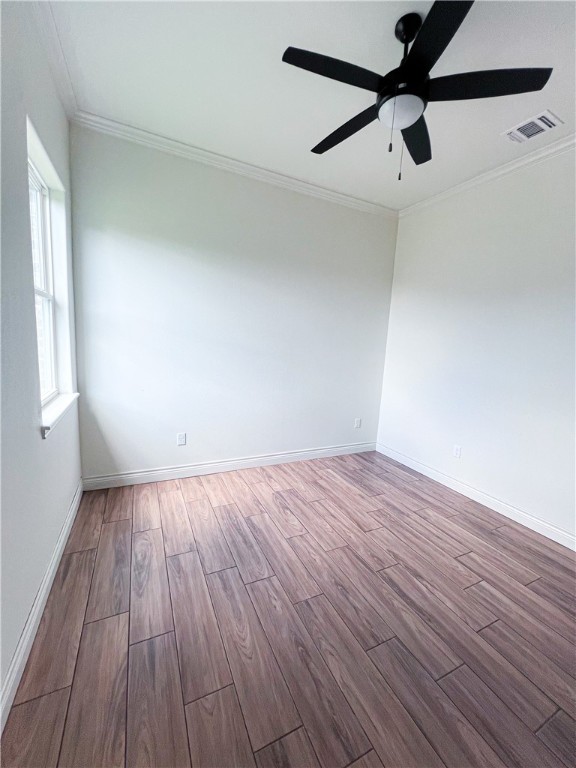 6918 Pacific Way Corpus Christi, TX 78414 - Photo 18 of 34 wooden floor in an empty room with a window