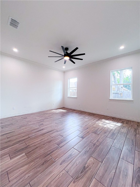 6918 Pacific Way Corpus Christi, TX 78414 - Photo 27 of 34 a view of an empty room with a window and wooden floor