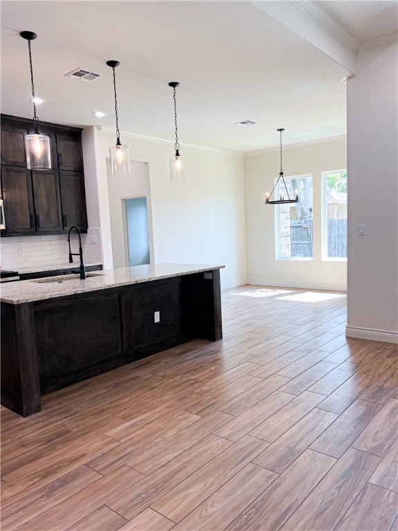 6918 Pacific Way Corpus Christi, TX 78414 - Photo 3 of 34 a kitchen with a wooden floor and a view of living room