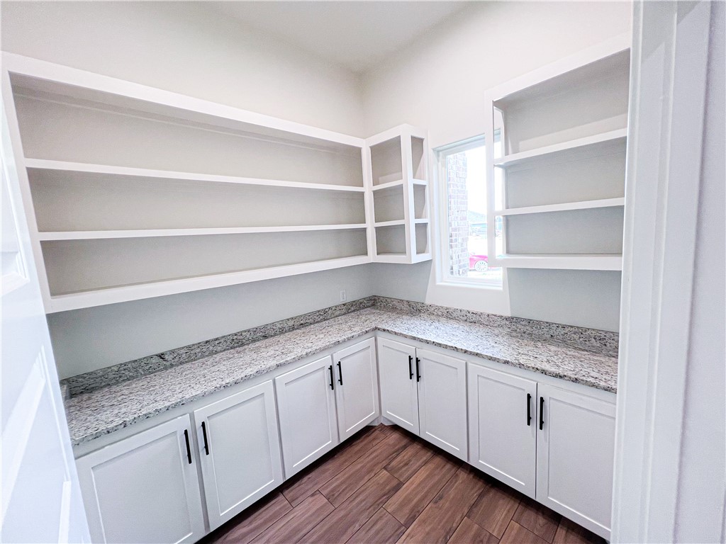 6918 Pacific Way Corpus Christi, TX 78414 - Photo 31 of 34 a kitchen with granite countertop white cabinets and a sink