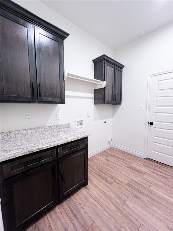 6918 Pacific Way Corpus Christi, TX 78414 - Photo 32 of 34 a kitchen with granite countertop wooden cabinets and a wooden floor