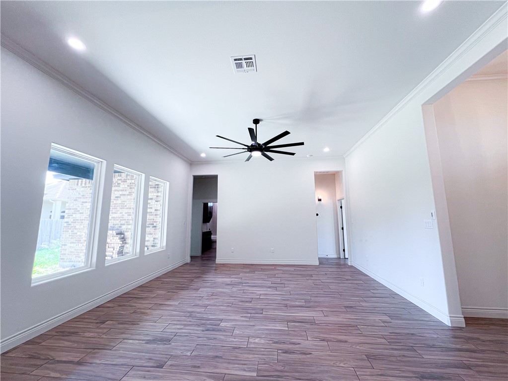 6918 Pacific Way Corpus Christi, TX 78414 - Photo 8 of 34 a view of an empty room with window and wooden floor