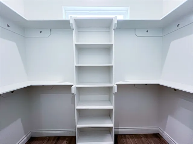 a view of an empty walk in closet