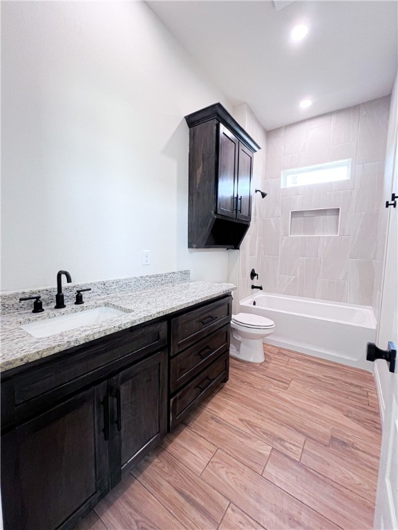 6918 Pacific Way Corpus Christi, TX 78414 - Photo 10 of 34 a spacious bathroom with a granite countertop sink toilet a large mirror a bathtub and shower