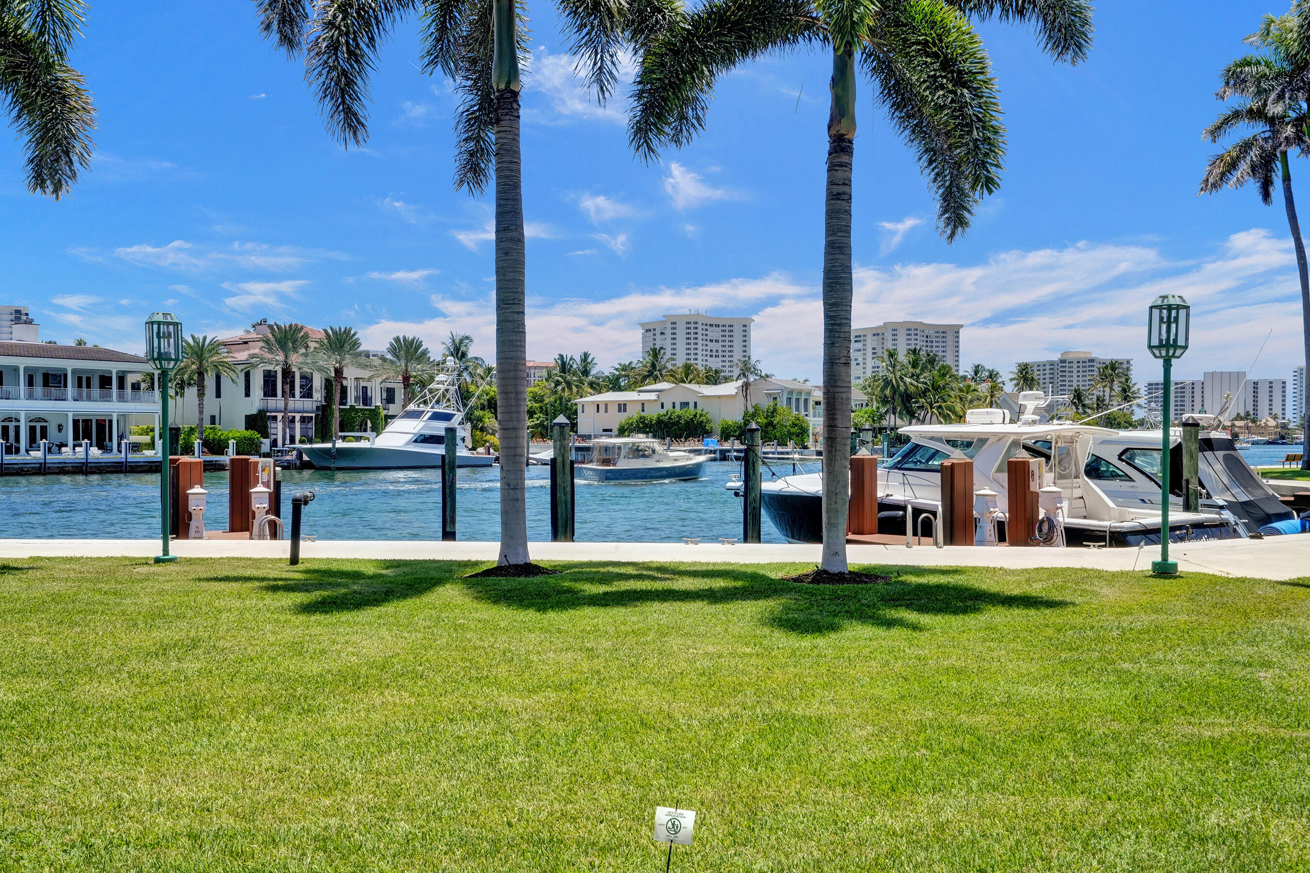 100 Southeast 5th Avenue, Unit 406 Boca Raton, FL 33432 - Photo 2 of 34 a view of a swimming pool with lawn chairs and a big yard