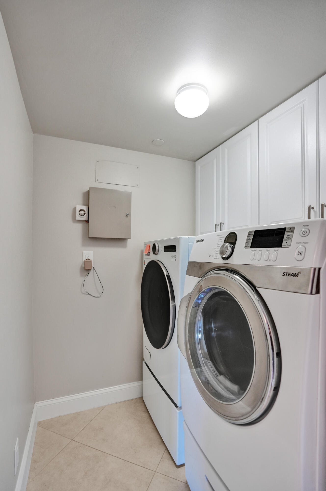 100 Southeast 5th Avenue, Unit 406 Boca Raton, FL 33432 - Photo 21 of 34 a utility room with sink dryer and washer
