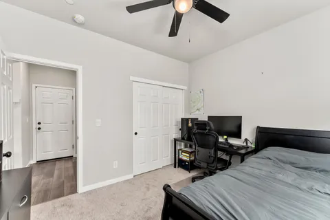 a view of a hallway with wooden floor and entryway