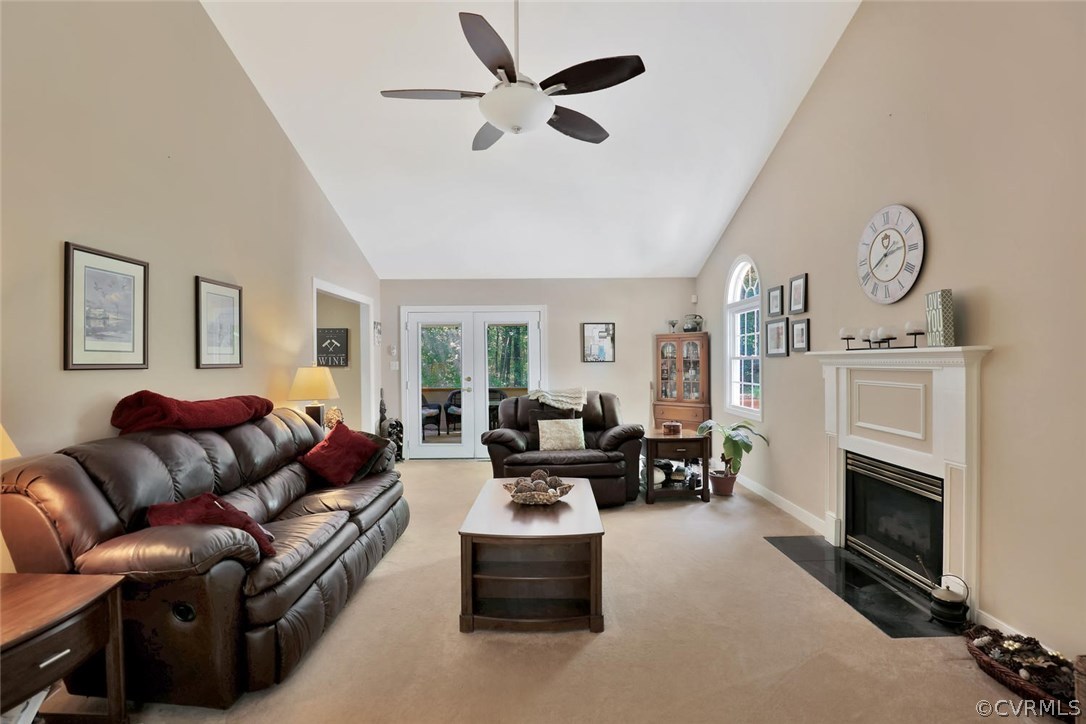 10920 Qualla Road Chesterfield, VA 23832 - Photo 5 of 20 a living room with furniture a fireplace and a large window