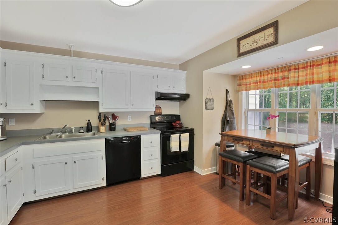10920 Qualla Road Chesterfield, VA 23832 - Photo 8 of 20 a kitchen with a stove a sink and a refrigerator
