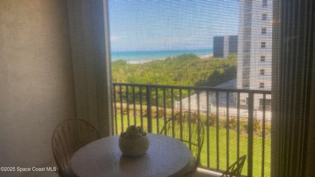 a view of a balcony with chair