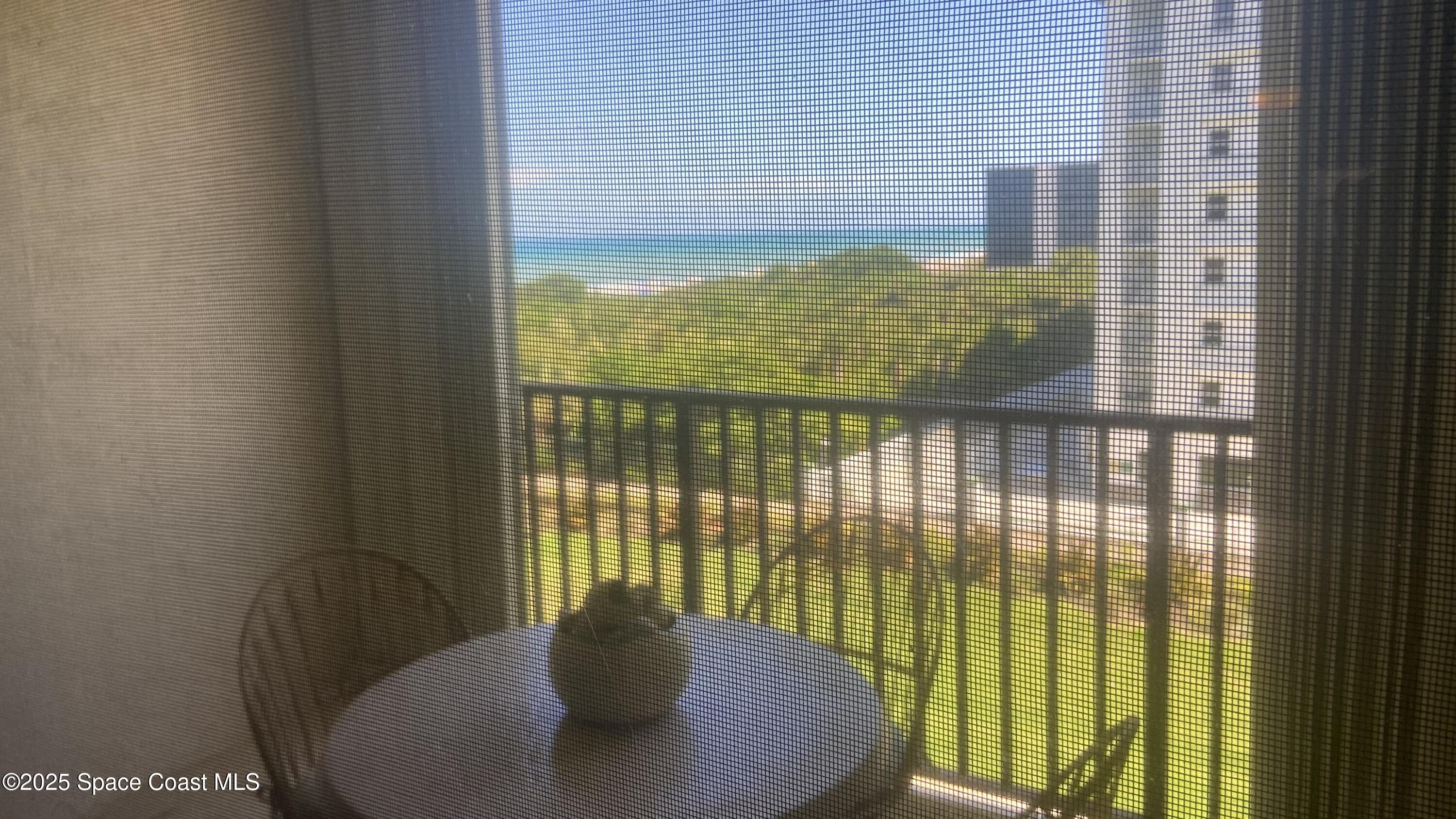 a view of a balcony with chair