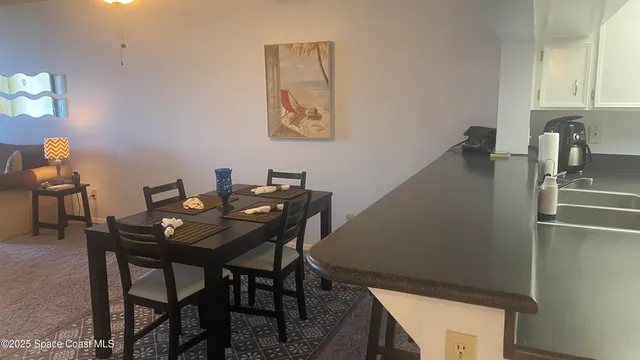 a view of a workspace with furniture