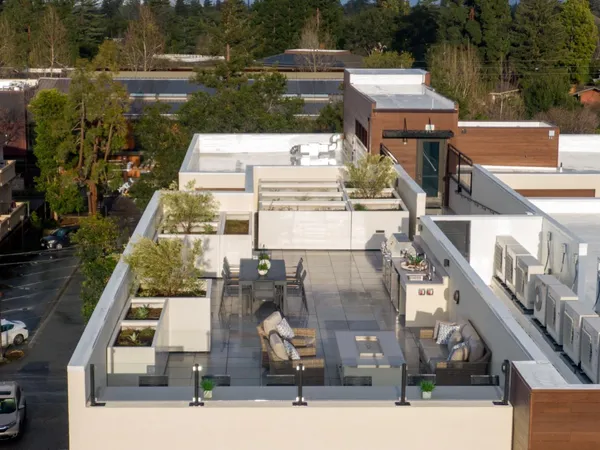 an aerial view of a house with a park