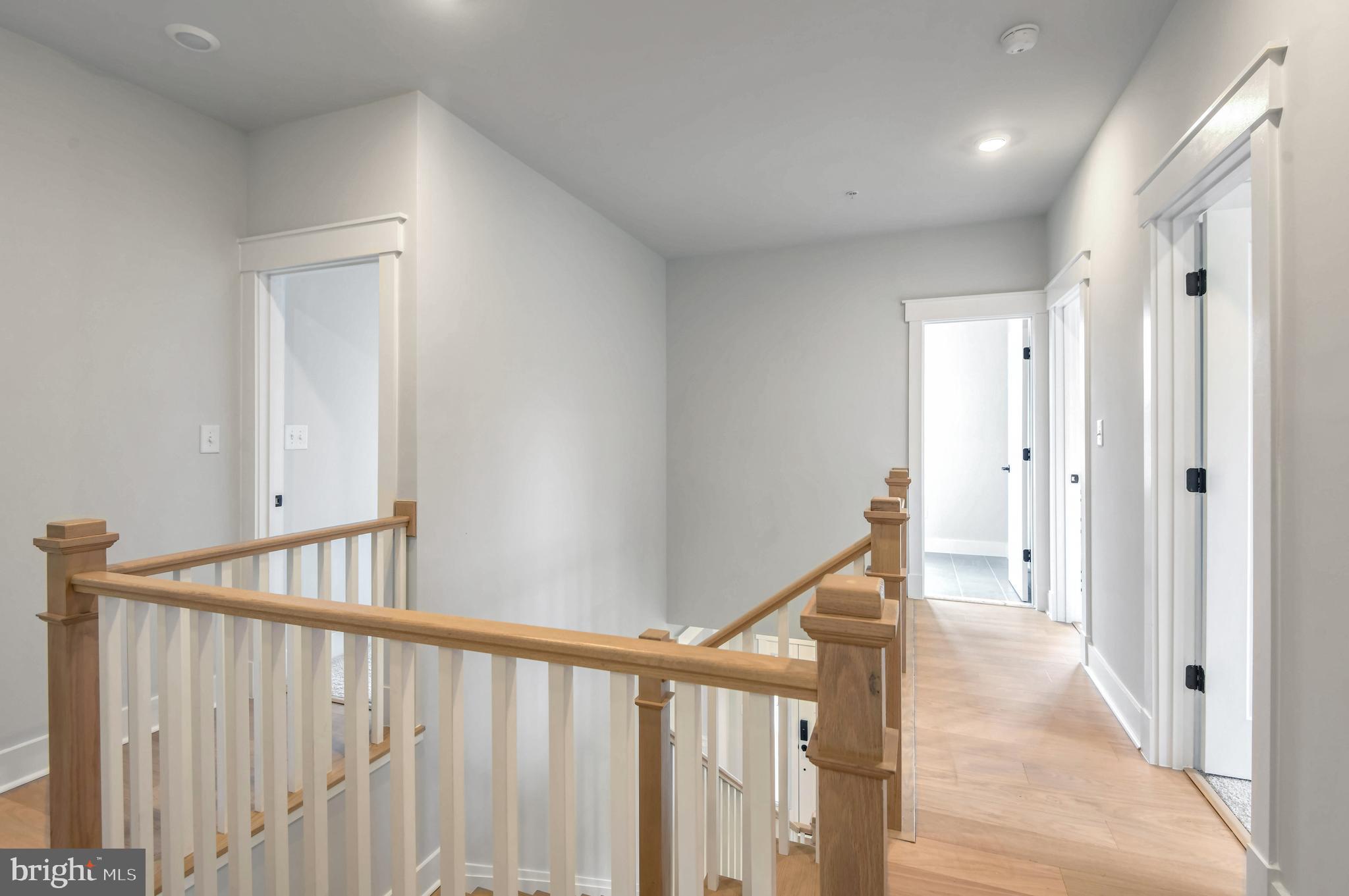Eliana Court Laurel, MD 20708 - Photo 20 of 46 a view of a hallway with wooden floor and stairs