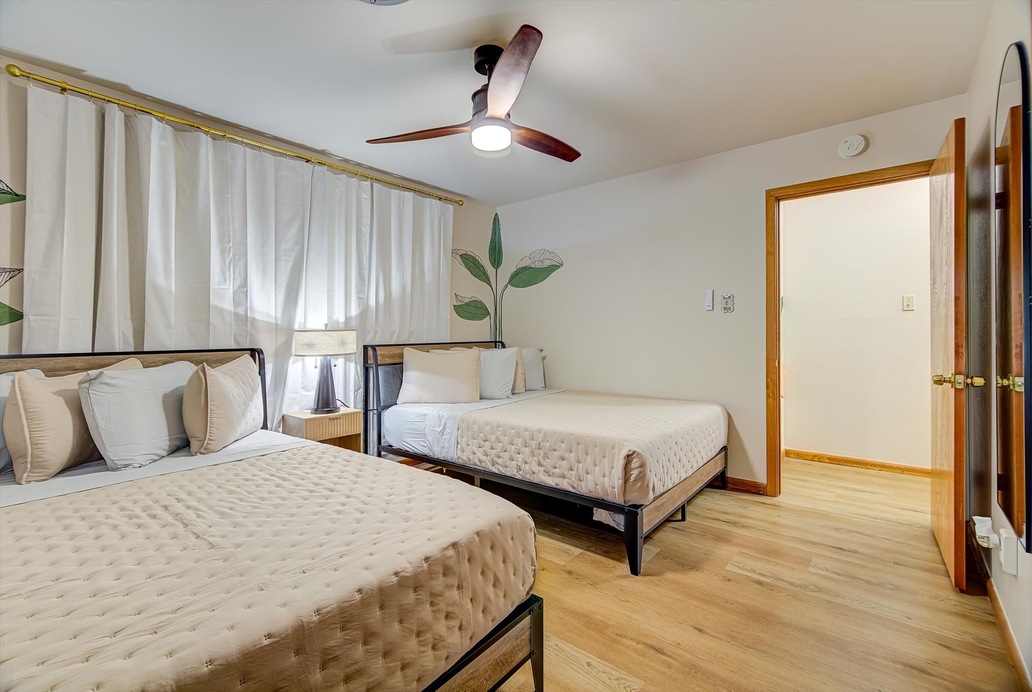 9825 Radio Road Houston, TX 77075 - Photo 28 of 50 a bedroom with two beds a lamp and a large window