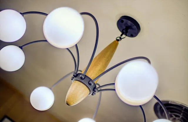 a kitchen with granite countertop a stove and cabinets