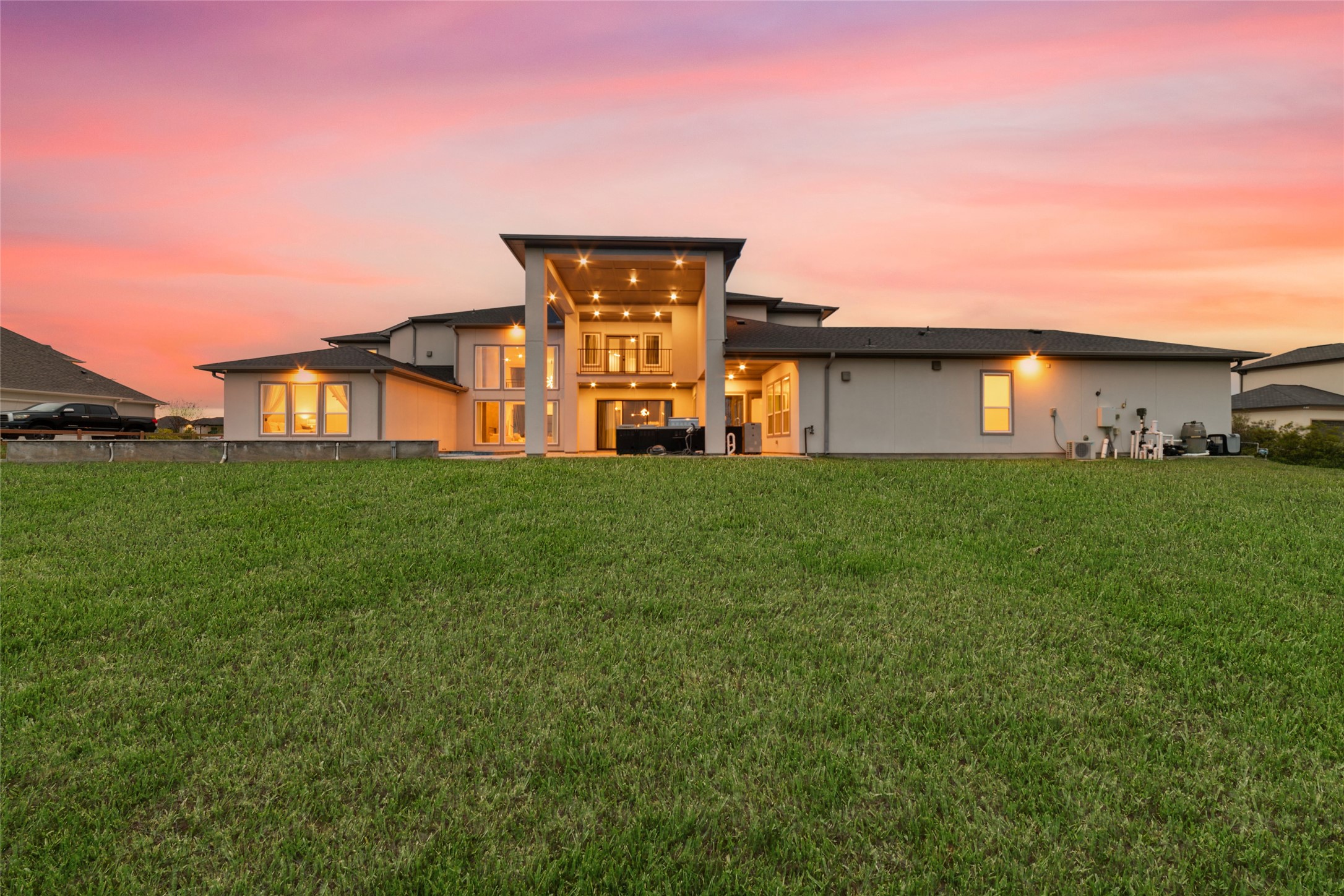 29627 Cir S Rnch Trail Fulshear, TX 77406 - Photo 47 of 50 From this perspective, it's easy to appreciate how beautifully the home lives. Expansive outdoor entertaining, multiple gathering spaces, and a peaceful lakefront setting all come together as one.