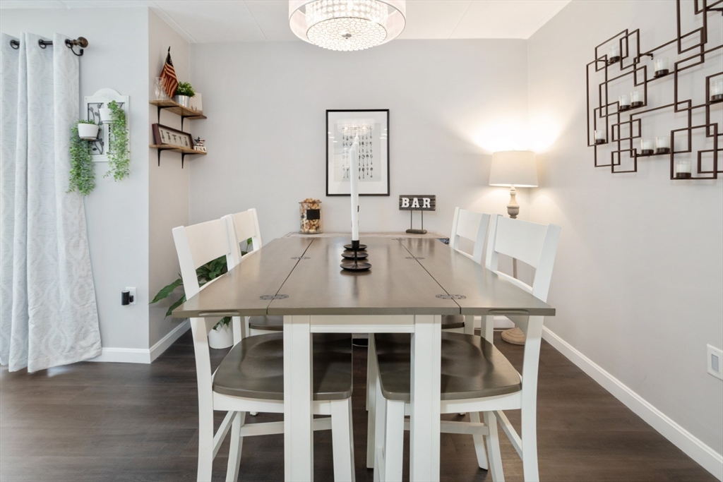 3 Ledgewood Way, Unit 8 Peabody, MA 01960 - Photo 13 of 36 a view of a dining room with furniture and wooden floor