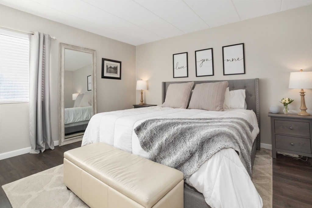 3 Ledgewood Way, Unit 8 Peabody, MA 01960 - Photo 15 of 36 a bedroom with a bed and a night stand