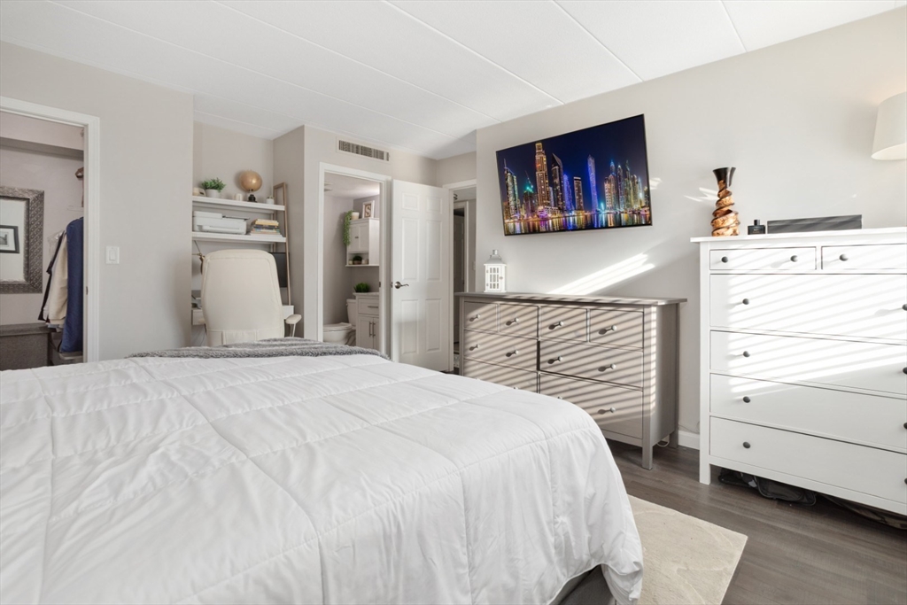 3 Ledgewood Way, Unit 8 Peabody, MA 01960 - Photo 16 of 36 a bedroom with a bed and a dresser