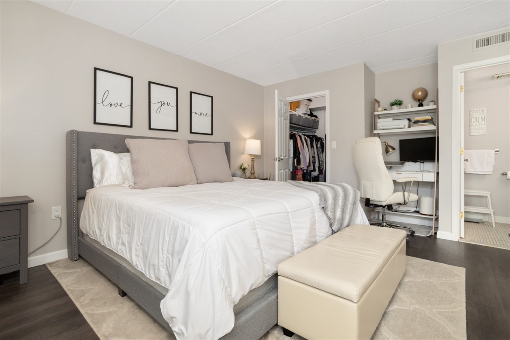 3 Ledgewood Way, Unit 8 Peabody, MA 01960 - Photo 17 of 36 a bedroom with a bed and a view of kitchen