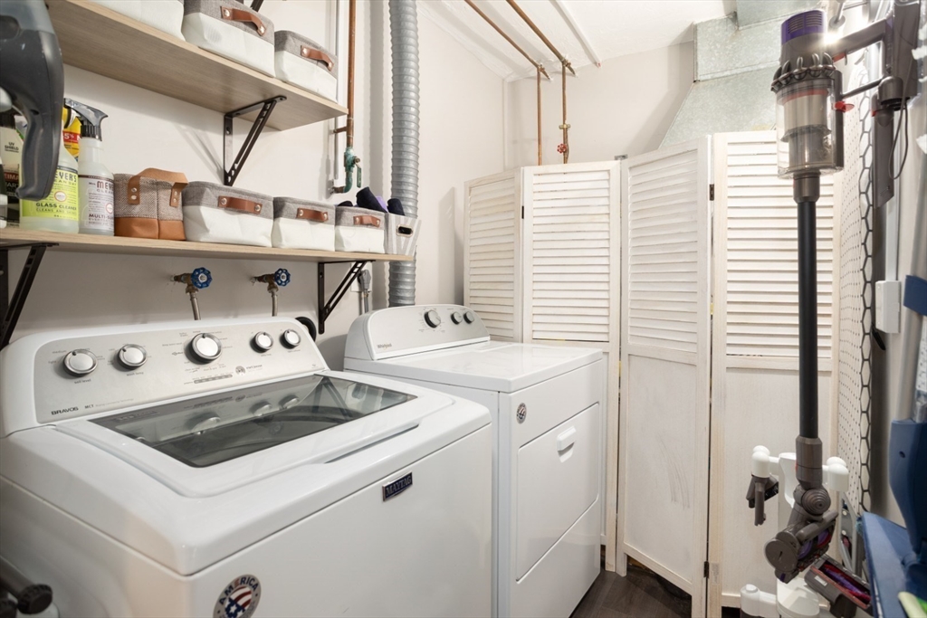 3 Ledgewood Way, Unit 8 Peabody, MA 01960 - Photo 30 of 36 a utility room with dryer and washer
