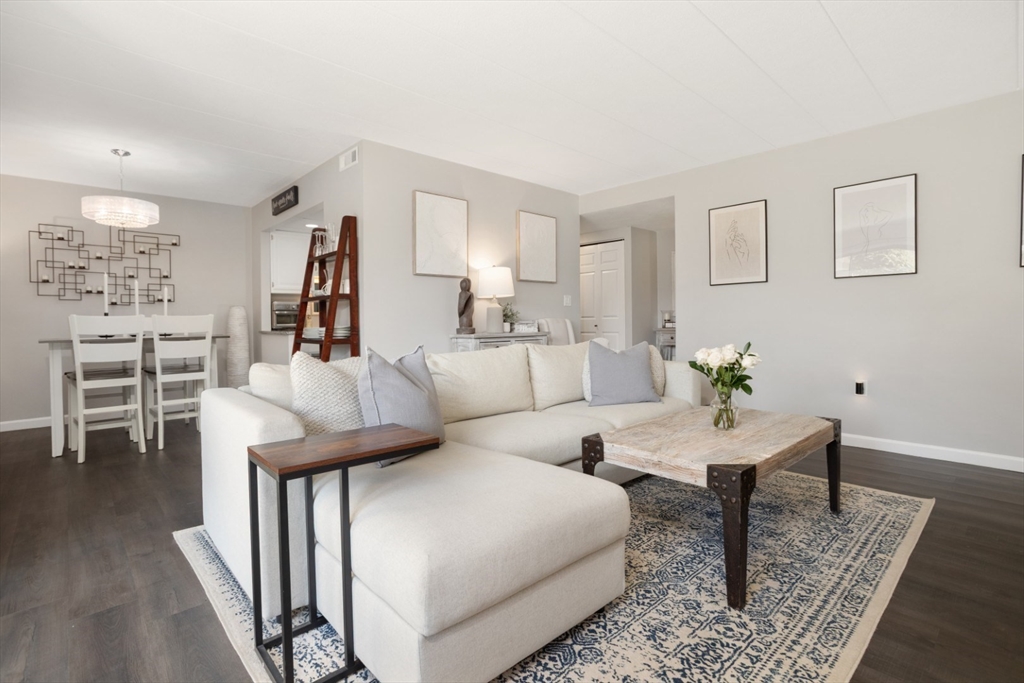3 Ledgewood Way, Unit 8 Peabody, MA 01960 - Photo 4 of 36 a living room with furniture and wooden floor