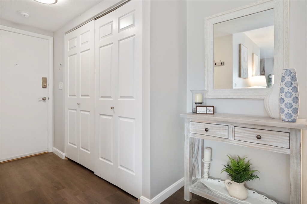 3 Ledgewood Way, Unit 8 Peabody, MA 01960 - Photo 8 of 36 a view of a hallway with washer and dryer
