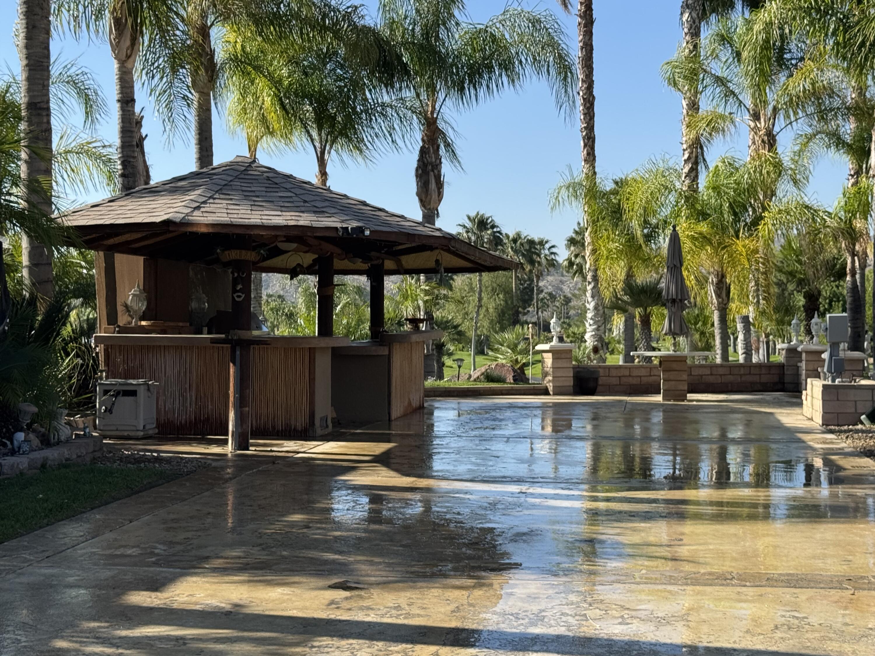 45525 Ca-79 S Temecula, CA 92590 - Photo 3 of 18 a view of a swimming pool with a table under an umbrella