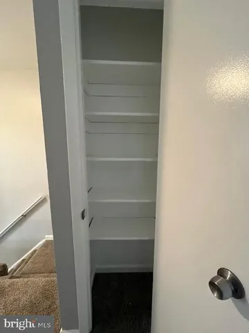 a view of staircase with white walls