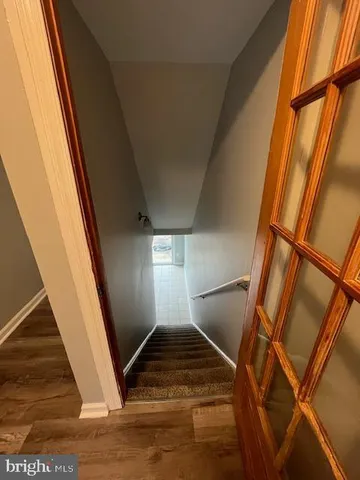 a view of an empty room and stairs