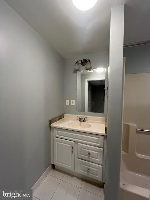14811 Ensor Court Woodbridge, VA 22193 - Photo 32 of 34 a bathroom with a sink and a mirror