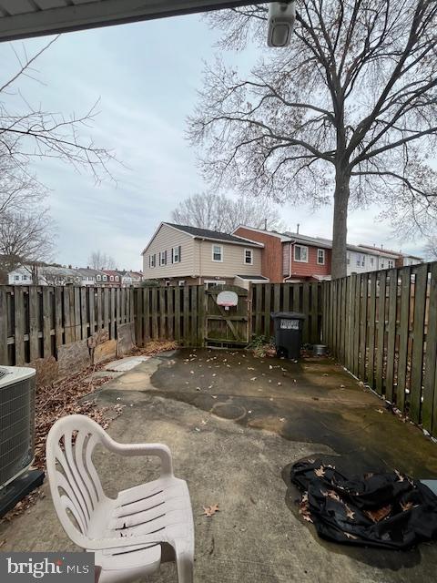 14811 Ensor Court Woodbridge, VA 22193 - Photo 33 of 34 a view of a backyard with wooden fence