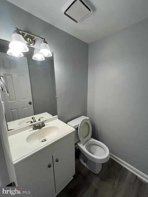 14811 Ensor Court Woodbridge, VA 22193 - Photo 8 of 34 a bathroom with a sink mirror vanity and toilet