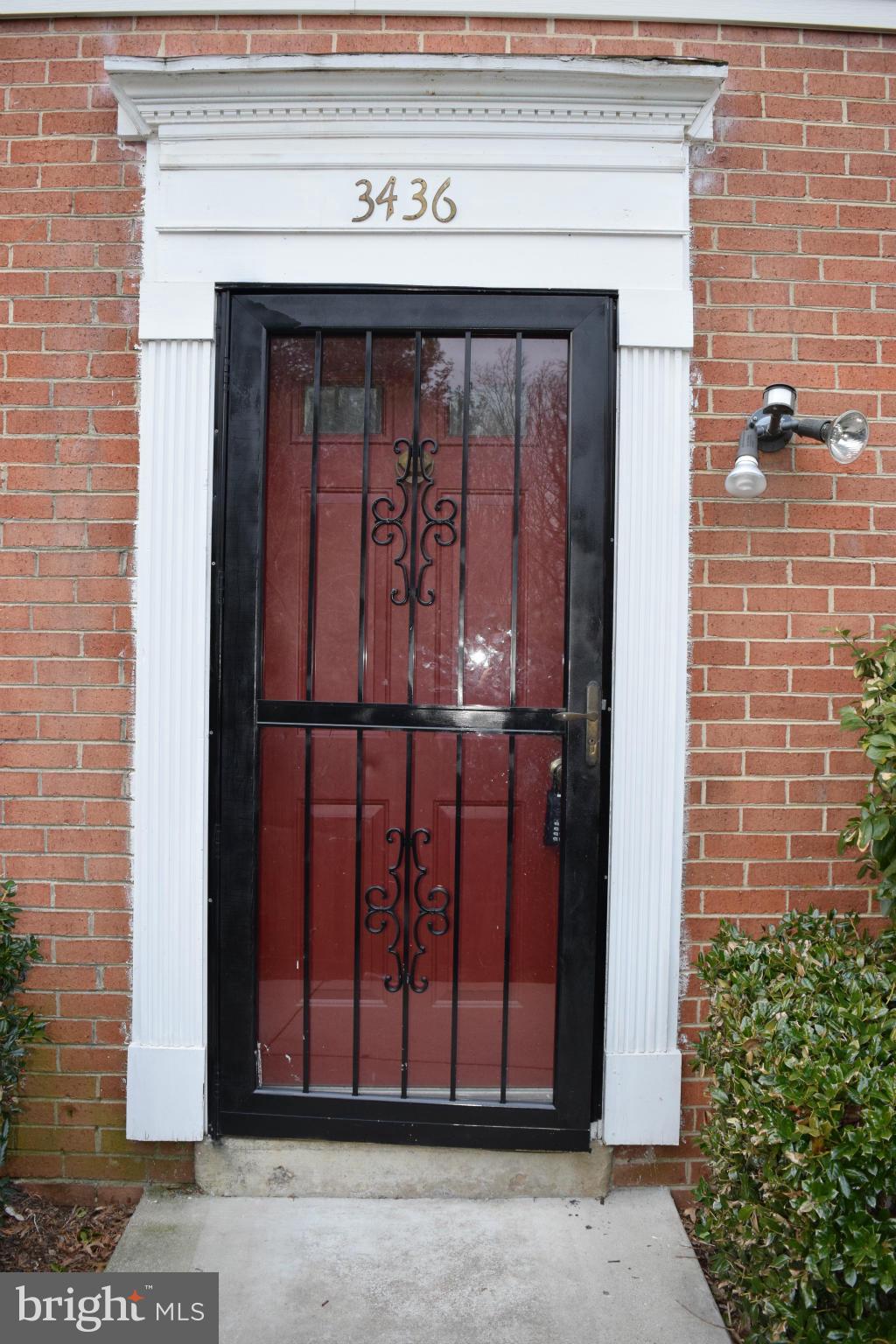 3436 Bruton Parish Way, Unit 25 Silver Spring, MD 20904 - Photo 1 of 6 a front view of a house with a garden