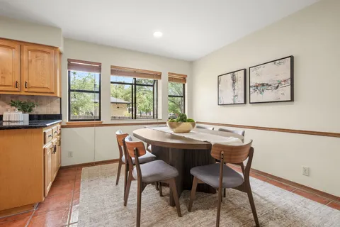 a dining room with furniture and window