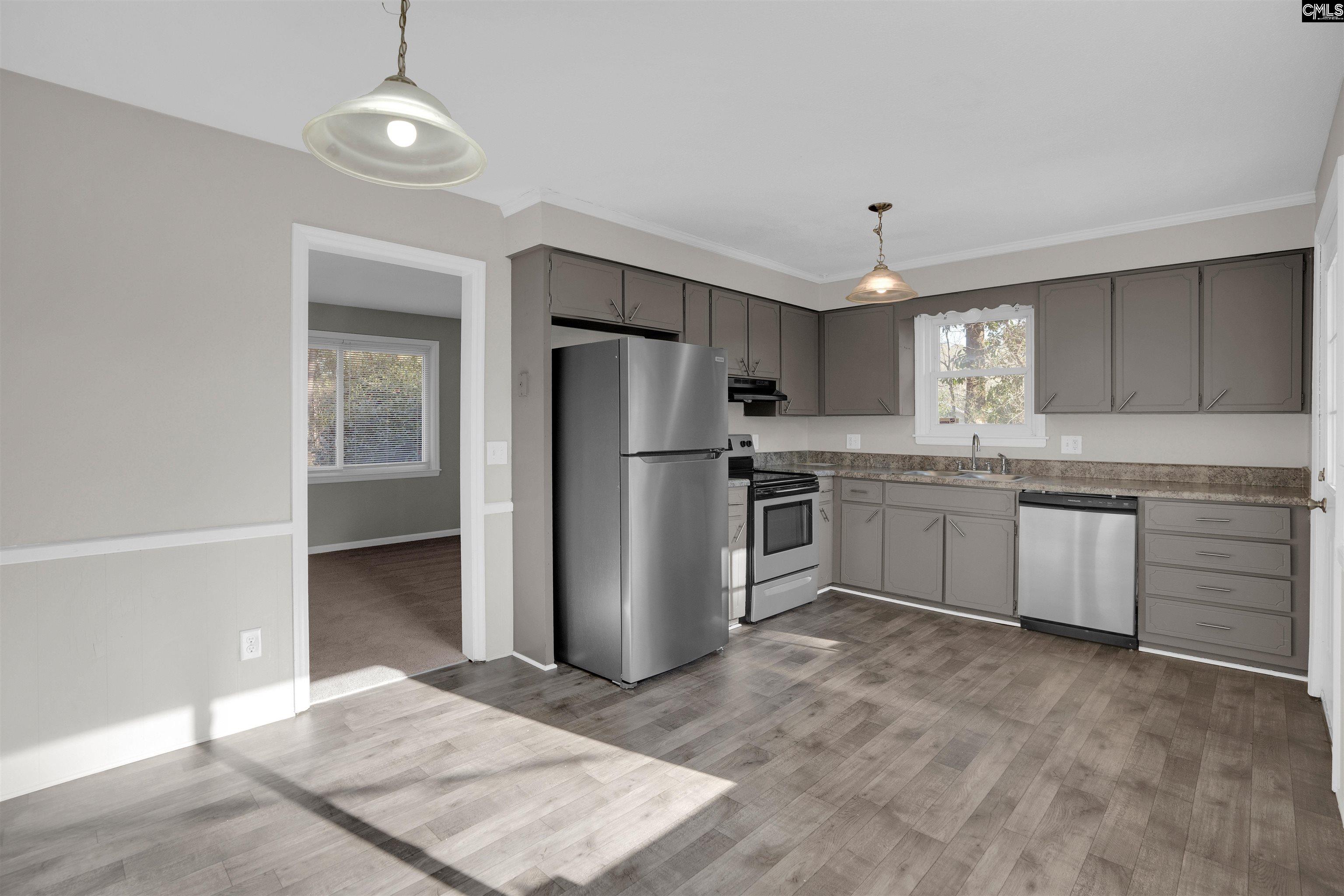 2620 Pleasant Ridge Drive Columbia, SC 29209 - Photo 8 of 37 a kitchen with a refrigerator sink and cabinets
