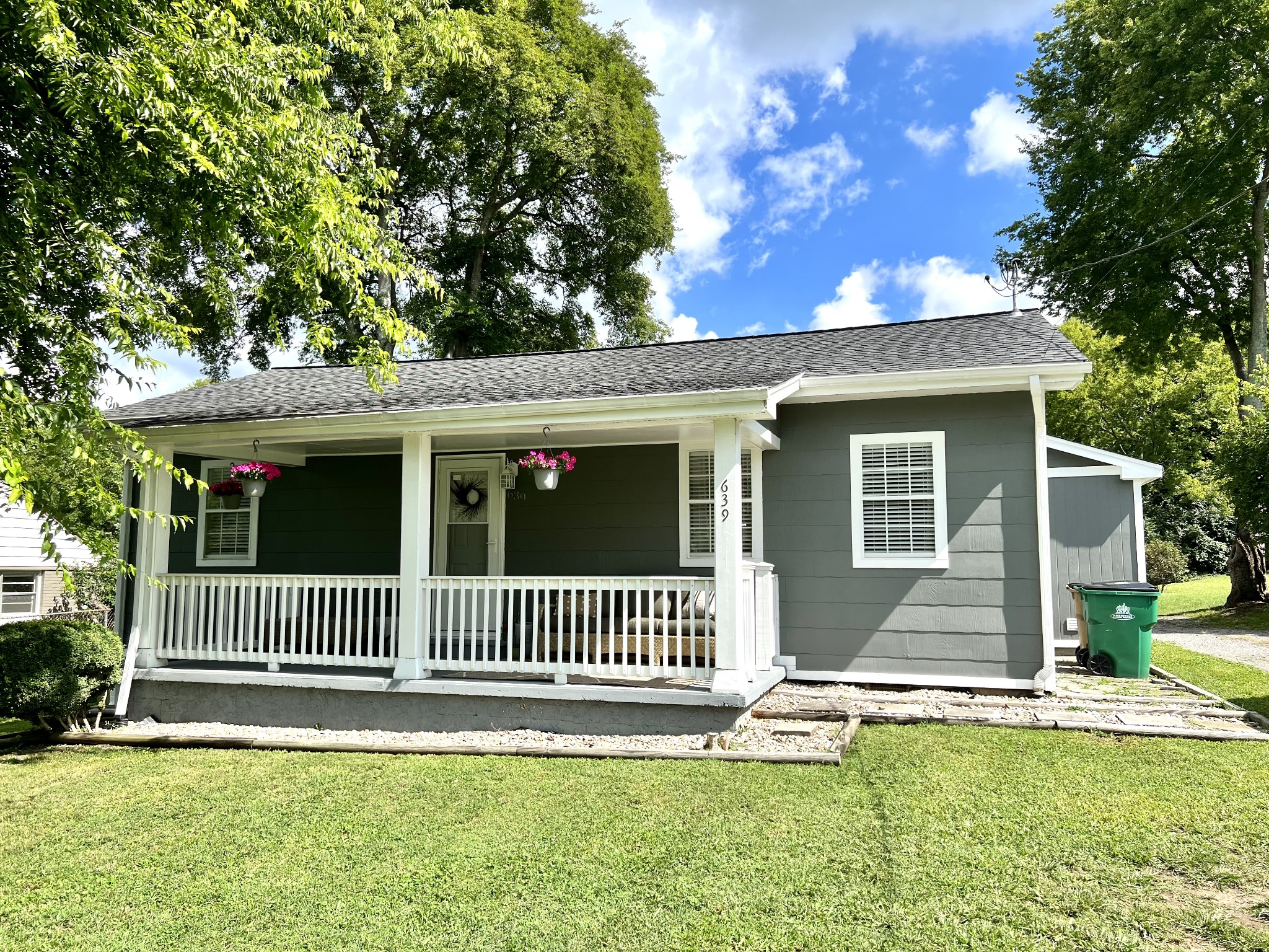639 Neelys Bend Road Madison, TN 37115 - Photo 1 of 16 a front view of a house with a garden