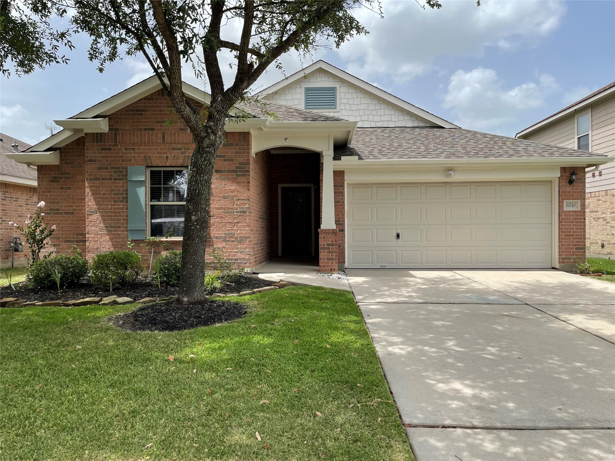6110 Moran Crest Drive Spring, TX 77388 - Photo 1 of 49 a front view of a house with a yard and garage