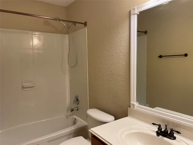 a bathroom with a sink and shower