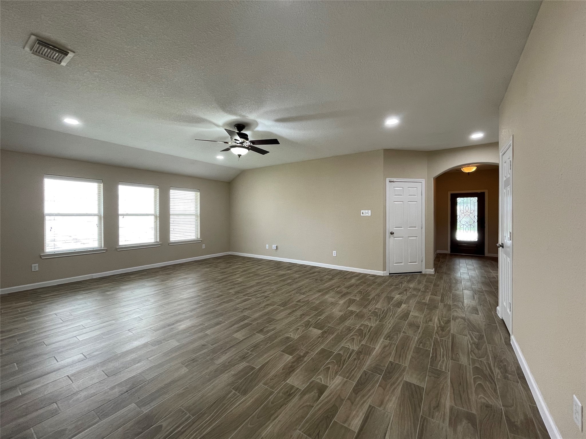 6110 Moran Crest Drive Spring, TX 77388 - Photo 20 of 49 a view of an empty room with wooden floor and a window